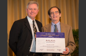 North Carolina Arts Council Executive Director Wayne Martin, left, congratulates NASAA Distinguished Public Service Award winner Bobby Kadis.