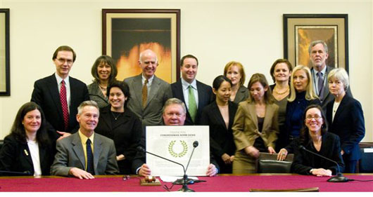 NASAA’s legislative counsel, Tom Birch, and other arts advocates gather to honor Rep. Norm Dicks