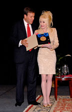 NEA Chair Dana Gioia presents the National Medal of Arts to Dolly Parton at the opening plenary session of Assembly 2008 in Chattanooga in September.