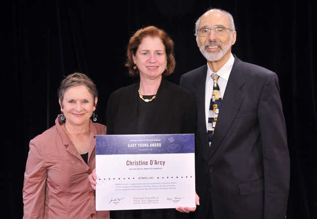 Christine D'Arcy (center), executive director of the Oregon Arts Commission, received NASAA's 2012 Gary Young Award. She is shown with Commission Chair Jean Boyer Cowling and Jonathan Katz. - Photo by Eddie Arrossi
