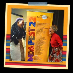 Two Black women stand next to a tall poster with the words Funda Fest 22.